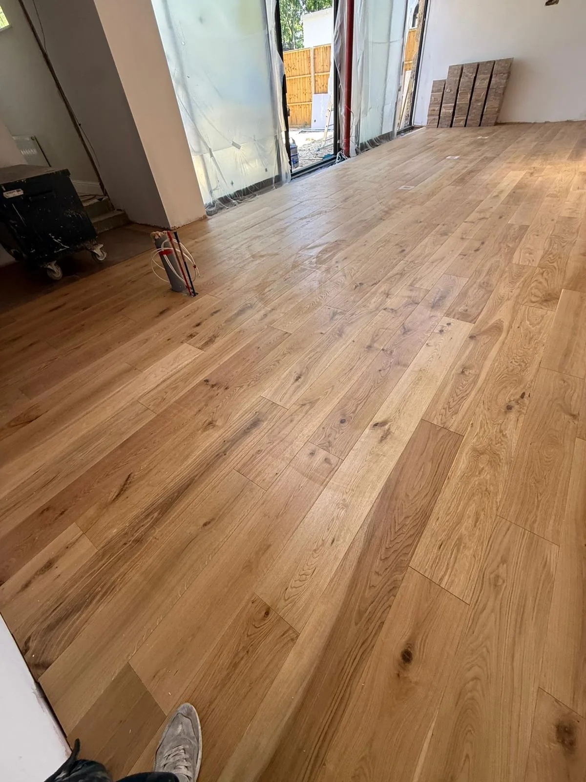 Invisible-Finish Oak Planks 190mm engineered oak flooring fitted in a through to the media room, Weybridge