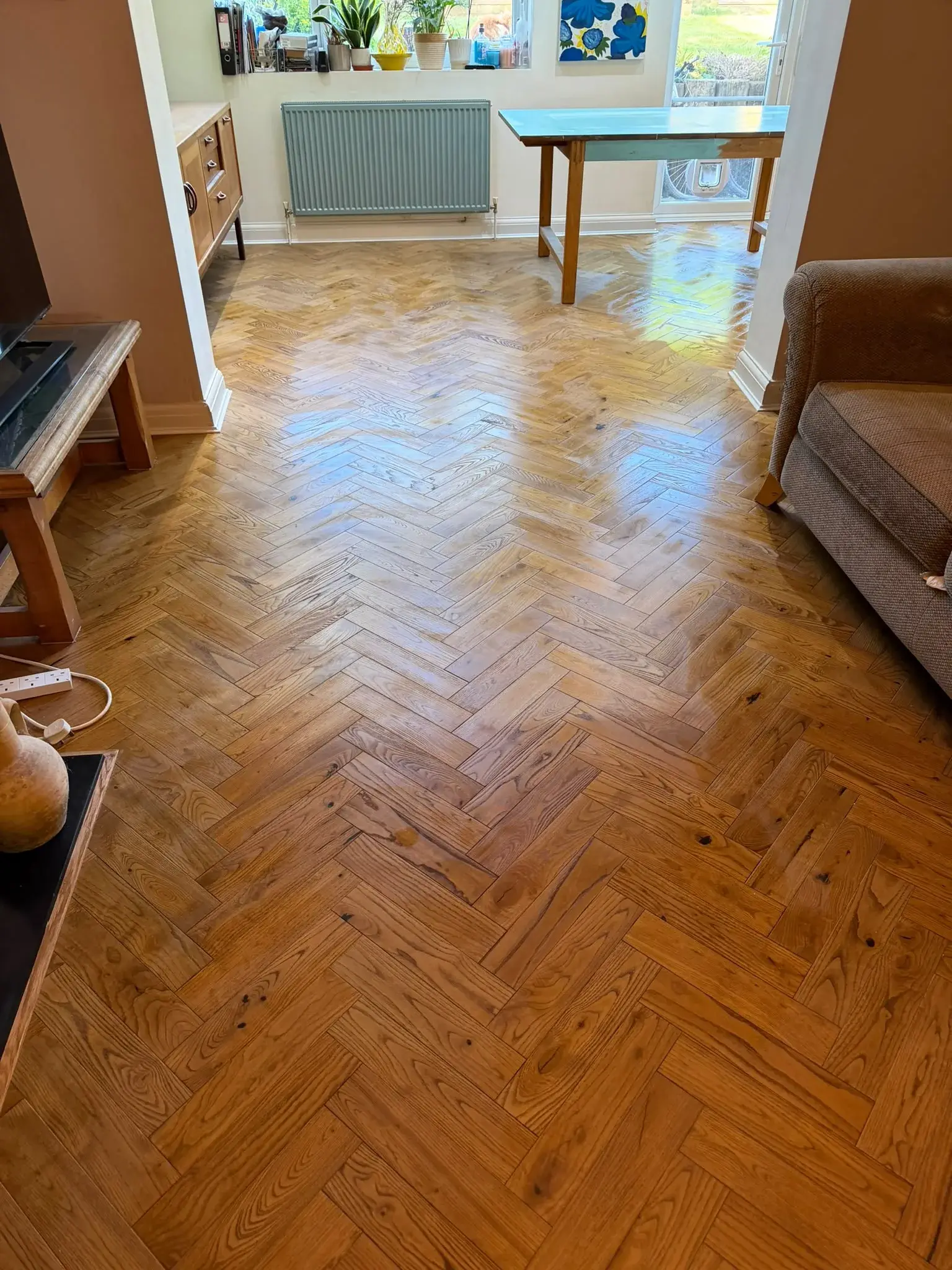 Warm Rustic Reclaimed Herringbone engineered oak flooring fitted in a living room, Guildford