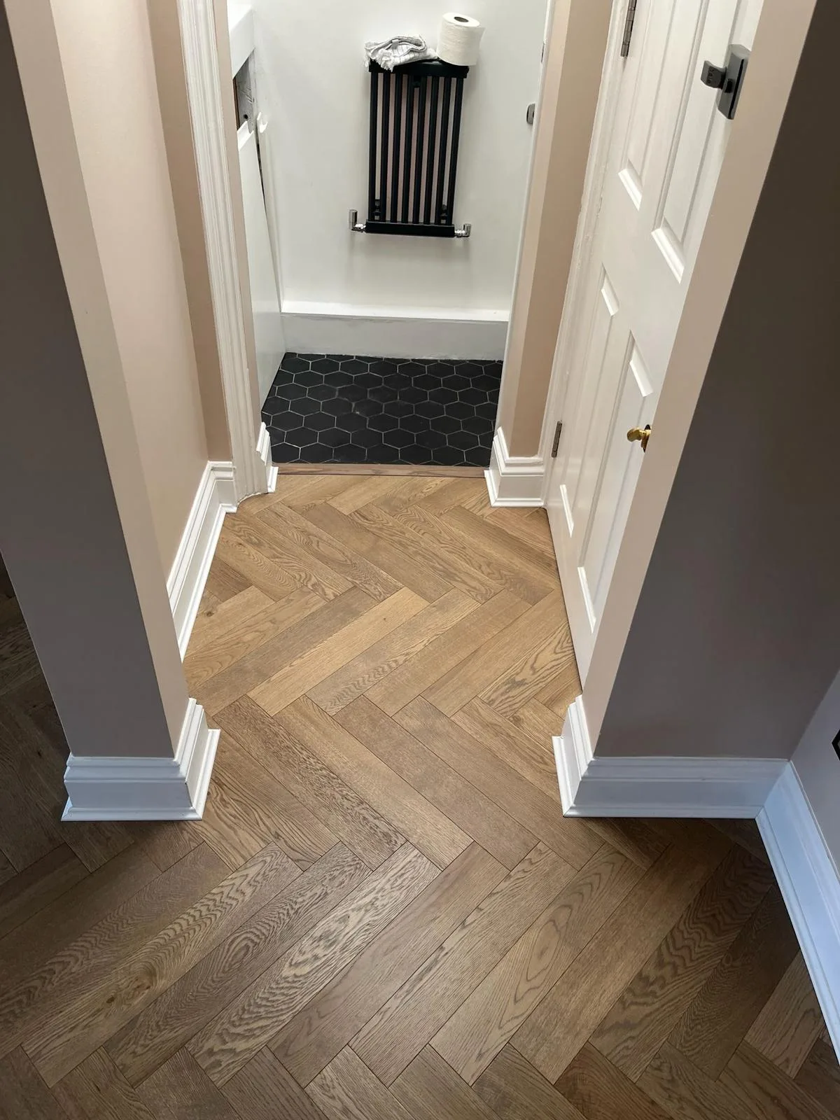 American Oak Herringbone Cool Grey engineered oak flooring fitted in a first-floor landing, Wimbledon