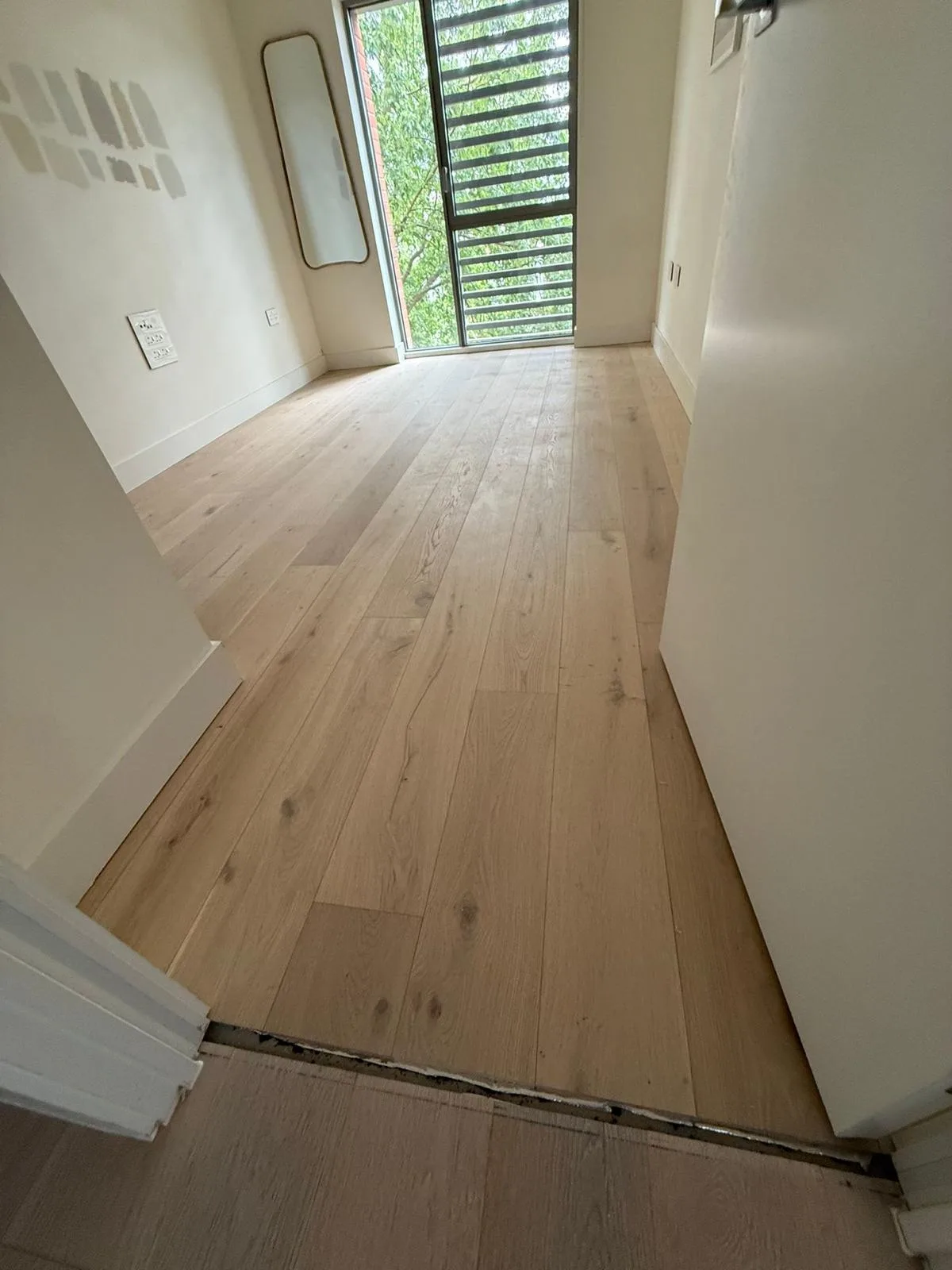 Scandinavian Natural Oak 190mm engineered oak flooring fitted in a bedroom and dressing area, Putney
