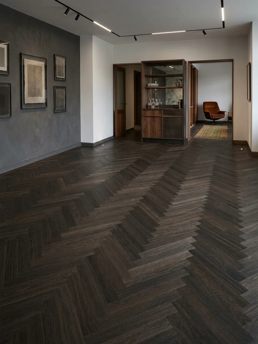 Dark smoked oak herringbone flooring in a reception hall, fitted by LIGNORA