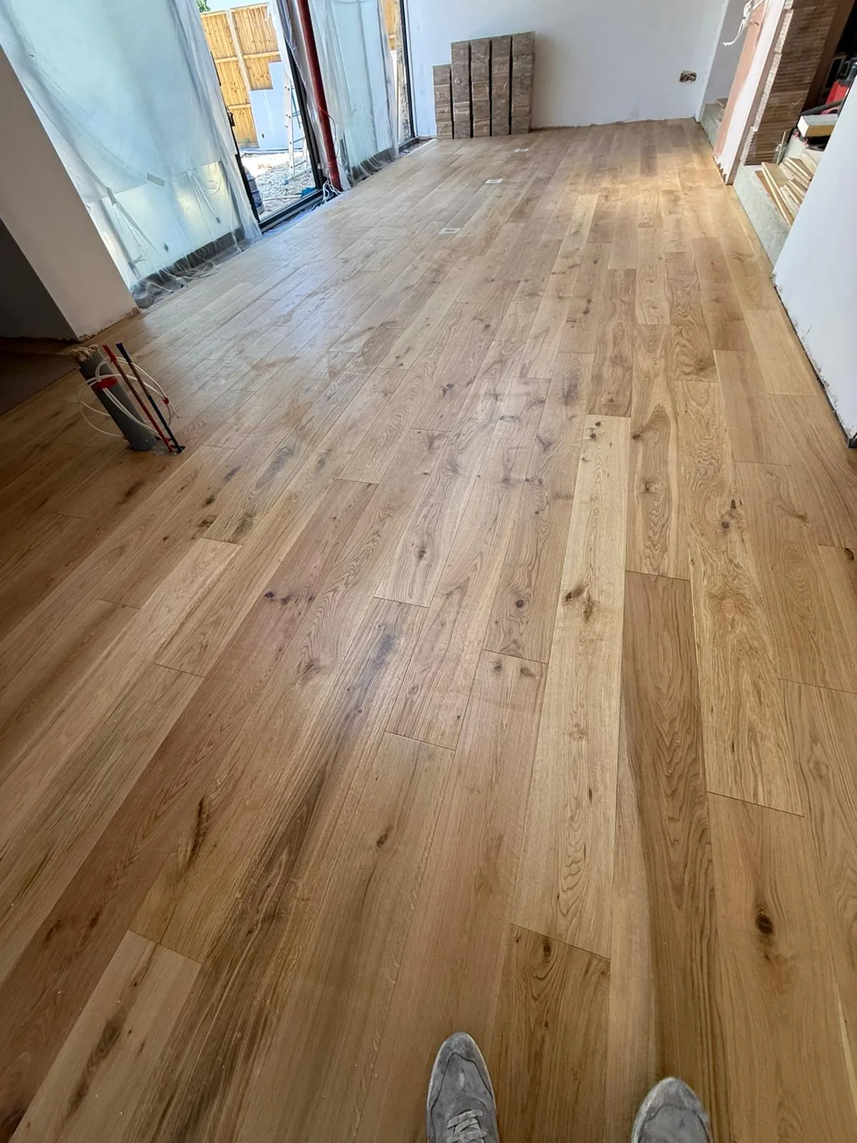 Invisible-Finish Oak Planks 190mm engineered oak flooring fitted in a kitchen-diner towards the garden, Weybridge