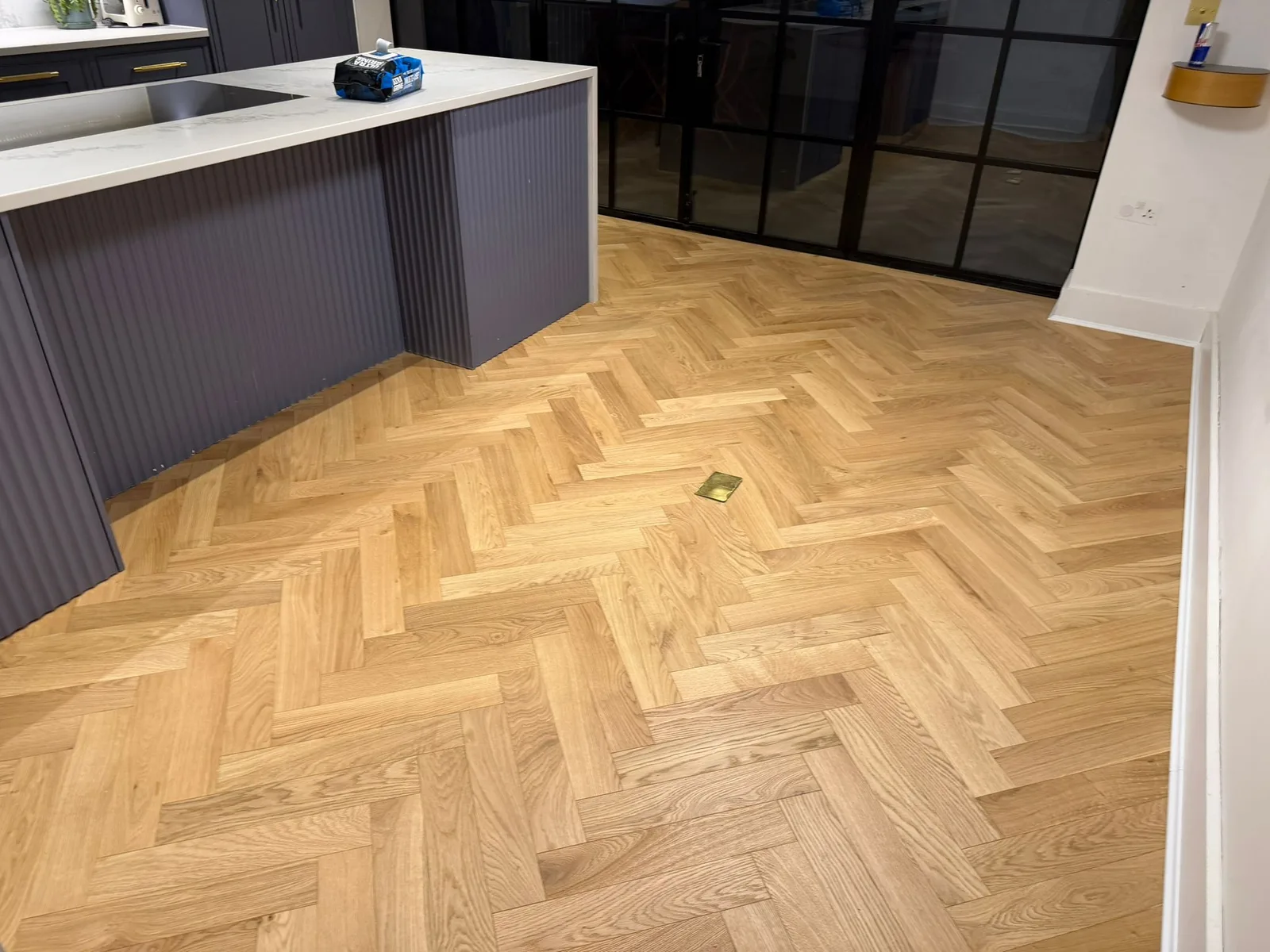American Oak Herringbone Mellow engineered oak flooring fitted in a kitchen, Richmond