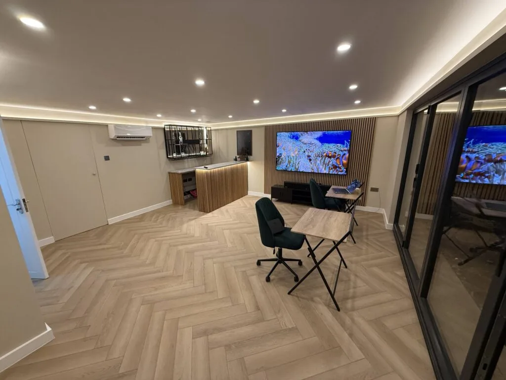 American Oak Herringbone Pale Ash engineered oak flooring fitted in a garden studio, Amersham