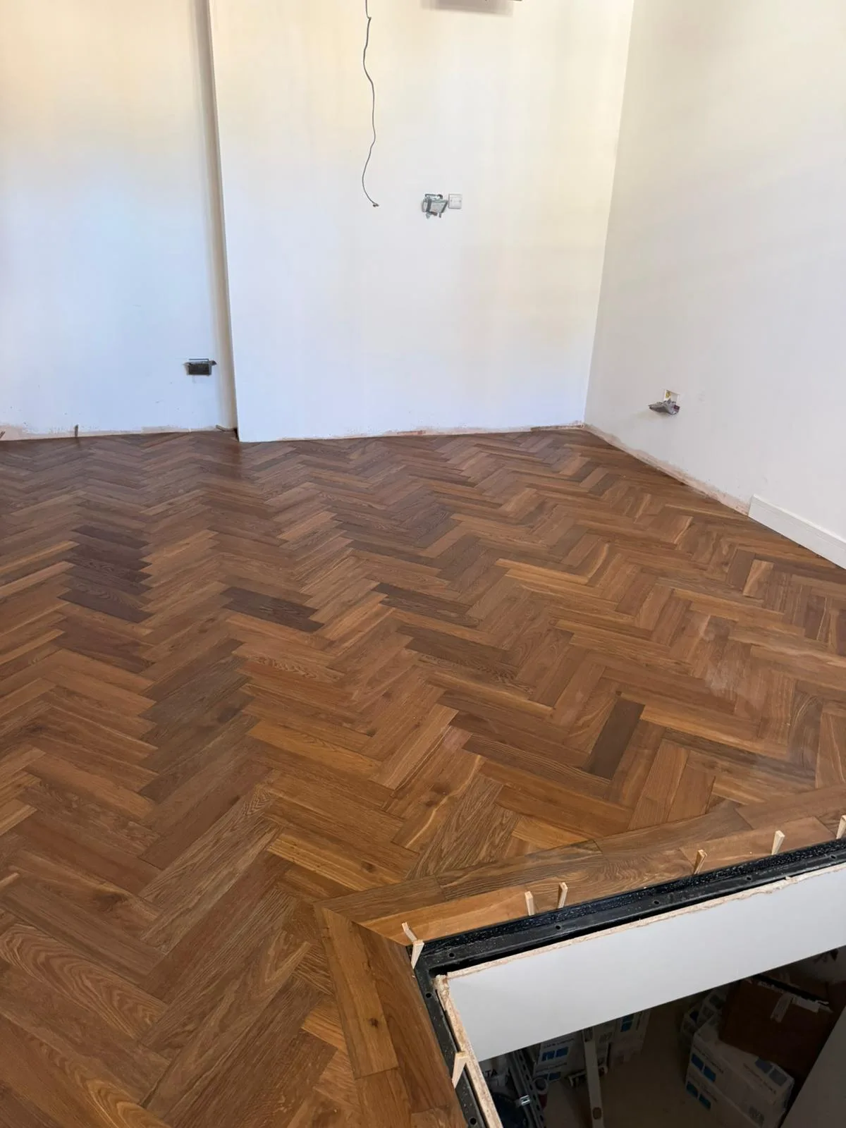 Warm Rustic Reclaimed Herringbone engineered oak flooring fitted in a sitting room, Sevenoaks