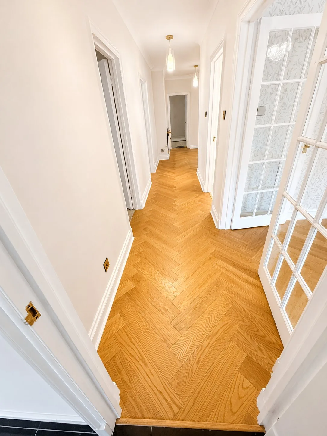 Herringbone oak flooring in a period hallway, Hampstead